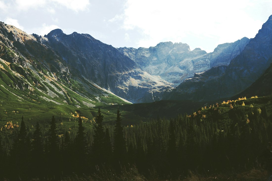 Green mountain valley under a clear sky